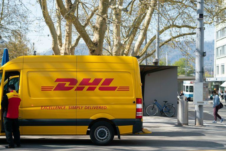Courier next to a yellow delivery van