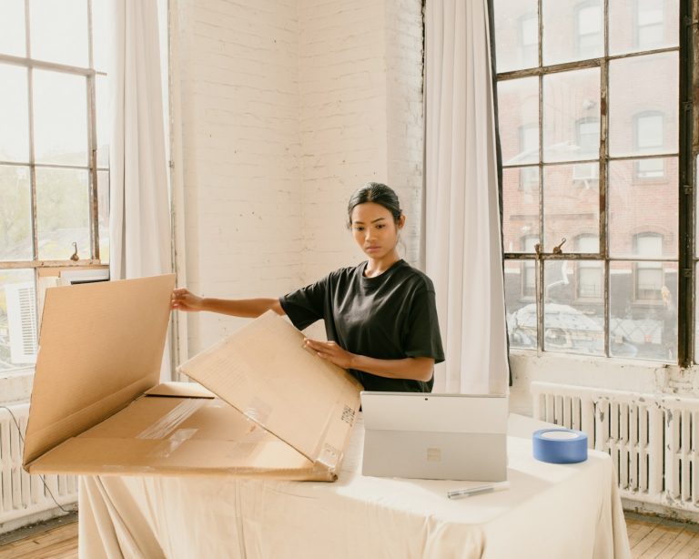 Small business owner packing an order